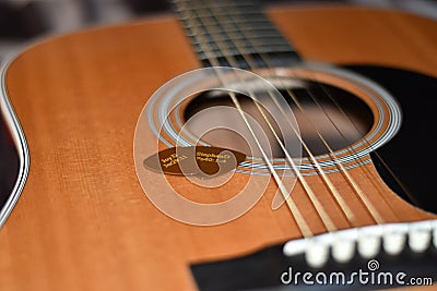 pick n guitar strings attatched Stock Photo