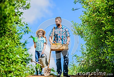 Pick out flats favorite plants. Garden works. Spring garden. Spring gardening checklist. Father and daughter with shovel Stock Photo