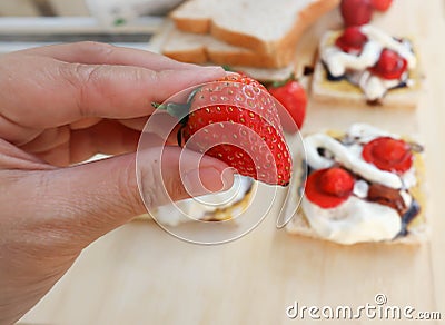 Pick strawberry or bread and canape with strawberry Stock Photo