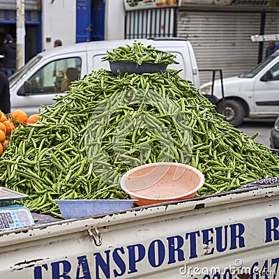 Pick-up truck with a mountain of beans on the truck bed is parked at the side of the road, waiting for bean buyers Editorial Stock Photo