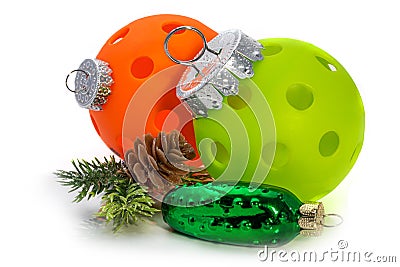 Pickleball Christmas decoration. Orange and Green Pickleballs dressed for the tree. Add a Pickle Please. Stock Photo