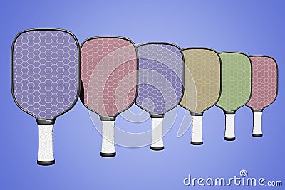 Pickleball multicolored rackets lined up in a row on an isolated background. 3D rendering Stock Photo