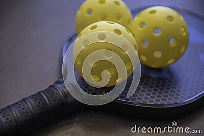 Pickleballs and a paddle Stock Photo