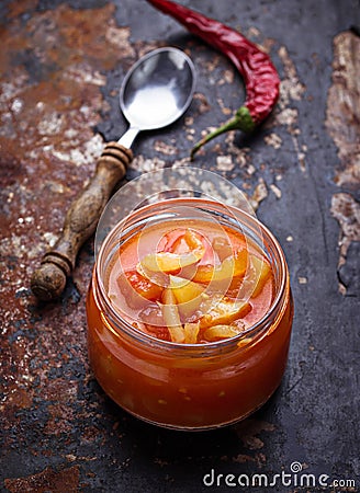 Pickled bulgarian peppers in a glass jar Stock Photo