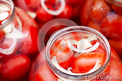 Pickled canned red tomatoes in jars Stock Photo