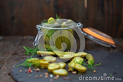 Homemade marinated cornichons in a jar Stock Photo