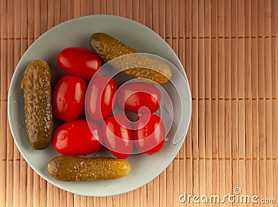 pickled cucumbers and tomatoes on a plate Stock Photo