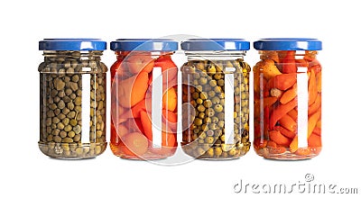 Pickled spices, capers, peppers, green peppercorns and piri piri, in glass jars Stock Photo