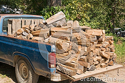 Pickup truck with firewood Stock Photo