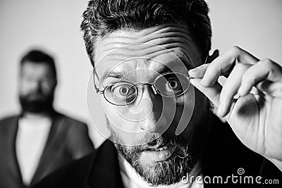 Picky smart inspector. Man handsome bearded guy wear eyeglasses. Eye health and sight. Optics and vision concept. Smart Stock Photo