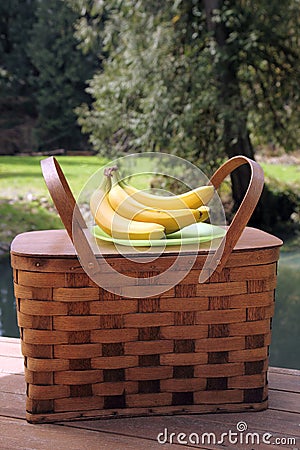 Picnic basket and fruit outdoors Stock Photo