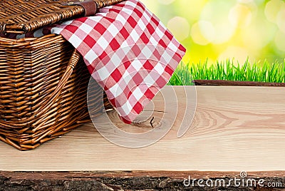 Picnic basket on the table with checked clothe Stock Photo