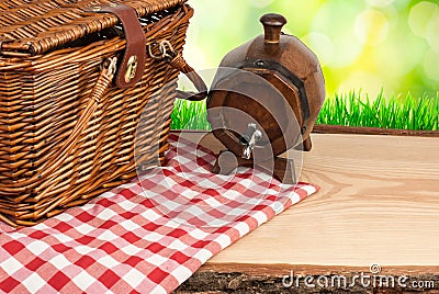 Picnic basket on the table and wine tun top angle Stock Photo