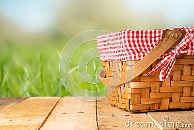 Picnic basket on a wooden table. relaxing on a picnic, and enjoyable in nature, with space Stock Photo