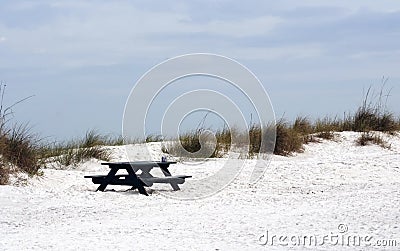 Picnic Bench on Deserted Beach Stock Photo