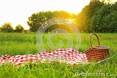 Picnic blanket and on grass in park Stock Photo