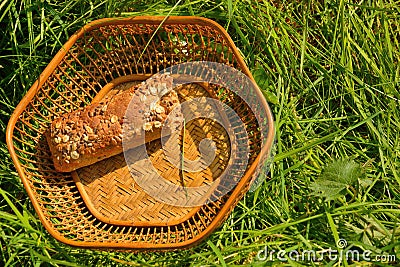 Picnic concept, basket with loaf of bread Stock Photo