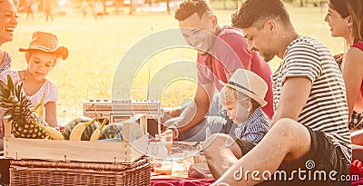 Picnic fun happy family with kids and friends at park. young multi racial families get together in park with cute infant and child Stock Photo