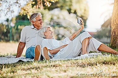 Picnic, selfie and senior couple with love, relax and connection with social media, retirement and marriage. Romance Stock Photo