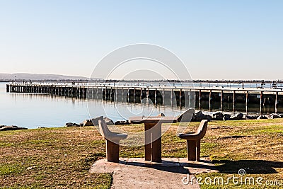 Picnic Table and Chairs with Pier in Chula Vista, California Stock Photo