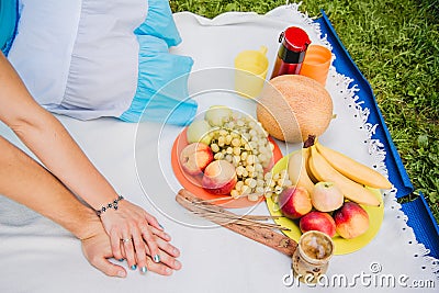 Picnic time. Young couple eating grapes and enjoying in picnic. Love and tenderness, dating, romance, lifestyle concept Stock Photo