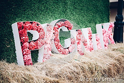 picnic word from pink peony flowers Stock Photo