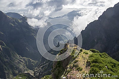 Pico do Arieiro hiking trail, amazing magic landscape with incredible views, rocks and mist, view of the valley between rocks Stock Photo