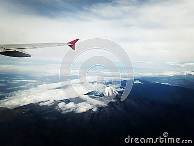 Volcano, mountains and clouds Stock Photo