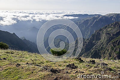 Pico Ruivo hiking, above clouds, amazing magic landscape, incredible views, sunny weather with low clouds, island Madeira, Portu Stock Photo
