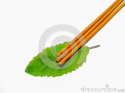 A picture of agarbatti on white surface , Stock Photo