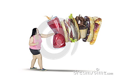 Asian obese woman punching unhealthy foods Stock Photo