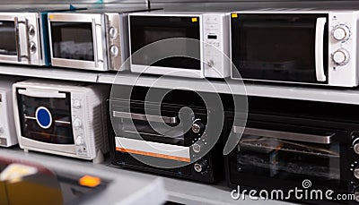 Assortment of a kitchen microwave at household appliances store Stock Photo