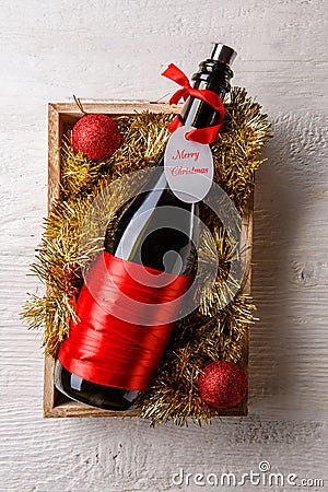 Picture of bottle of wine with card in wooden box Stock Photo