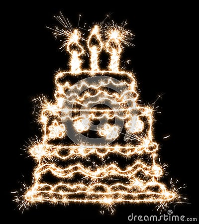 A picture of a cake with sparklers on a black background, imitation of a long exposure Stock Photo