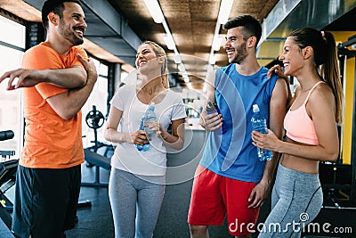 Picture of cheerful fitness team in gym Stock Photo