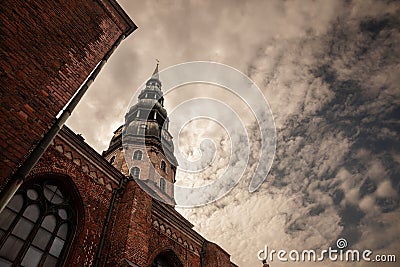 Main tower of Riga Church of Saint Peter at dusk. Saint Peter Church Cathedral also called Sveta Petera Evangeliski luteriska Stock Photo