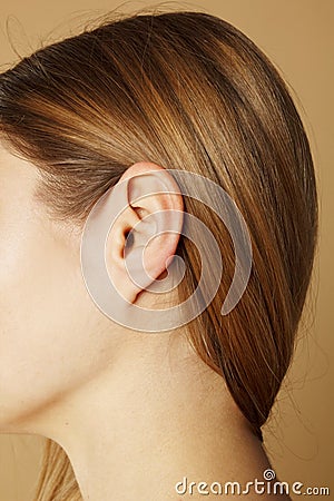 Picture of close up woman`s ear Stock Photo