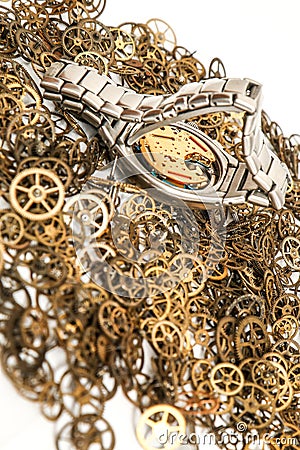 Cogwheels with a analog wrist watch Stock Photo