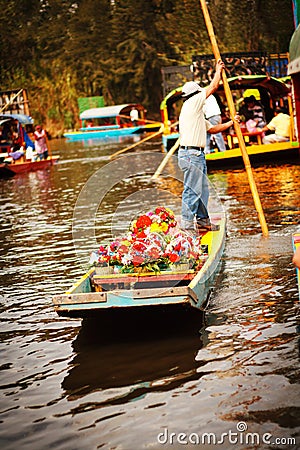 Picture of the colorful boats on ancient Aztec canals at Xochimilco in Mexico. Trajineras. Editorial Stock Photo