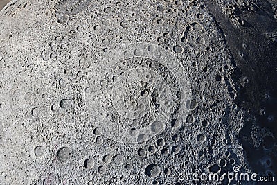 A picture of craters on the surface of the moon Stock Photo