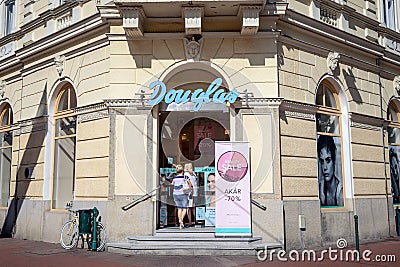 Douglas Cosmetics Logo on their main shop in Szeged. Douglas is a German perfume and cosmetics retailer Editorial Stock Photo
