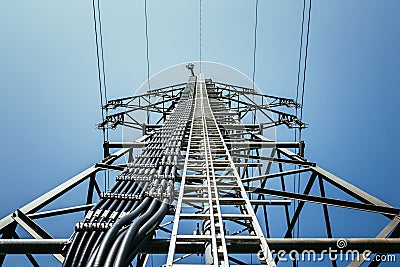 Close up of electrical tower and blue sky. Renewable energy and smart grid Stock Photo