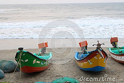 This is a picture of fishing boats parked near the seashore Stock Photo