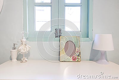 Picture flame , lamp and perfume Bottle on wooden vanity table Stock Photo