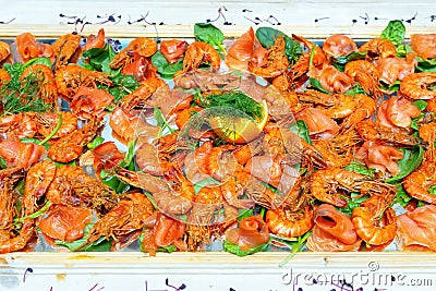 Shrimps on a buffet decorated on a mirror Stock Photo