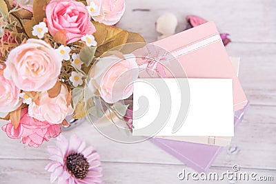 Picture of gift box with red ribbon with flower and gift card on Stock Photo