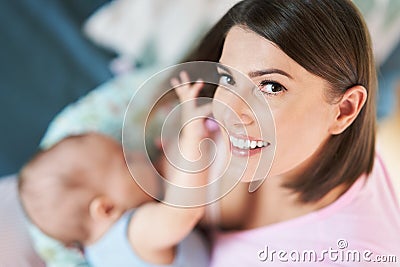 Happy Mother breastfeeding Newborn Baby Stock Photo