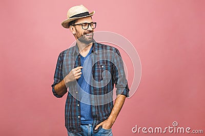 Picture of happy young man standing isolated over pink background. Looking at camera Stock Photo