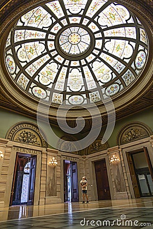 Little girl looking up at a glass dome window in a museum Editorial Stock Photo