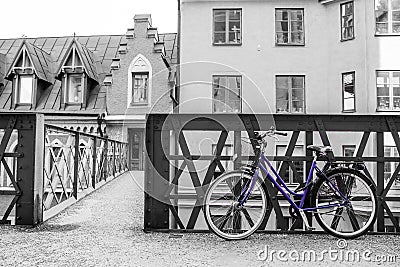 Lonely blue bike standing in the typical street in Stockholm Stock Photo